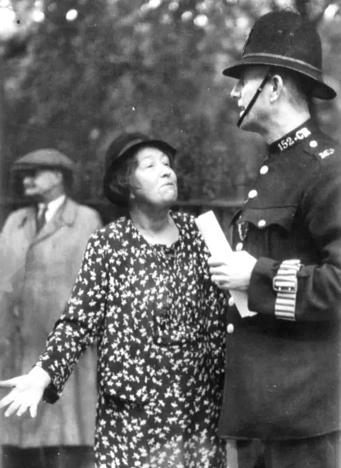 Pankhurst ExplainsSylvia Pankhurst, the famed suffragette leader of three decades ago, tells a London Bobby, outside the Italian embassy June 13, why she has just placed a copy of the Abyssinian paper "Ethiopian News" on the Embassy steps as a protest gesture. June 24, 1940. (Photo by Associated Press Photo).