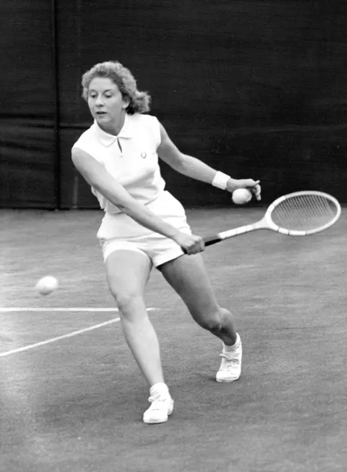 All England Lawn Tennis Championships At Wimbledon -- Lea Pericoli, of Italy, who was partnered Mrs. M. Migliori, in play in their doubles match against Mrs. J. ***** and Miss D.R. Hard. June 24, 1955. (Photo by Fox Photos).