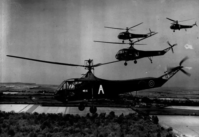 Helicopters Are Here To Stay: The R.A.F.'s "Go Any Way" Service -- A formation of R.A.F helicopters in flight Andrews Planet Apr. 23 1945 PN Censor Nos.Rising vertically from the ground or rooftop, flying backwards, forwards or sideways, and hovering to drop or pick up passengers, the Sikorsky R4B helicopter, now contributing to the development of an R.A.F. helicopter service, has shown that these aircraft, with till notable advantages for special purposes, will play en important part in Britain's aerial activities after the war. These photographs were taken during training at an R.L.F. school,. end for the first time in history shore helicopters flying and hovering in formation. April 23, 1945.