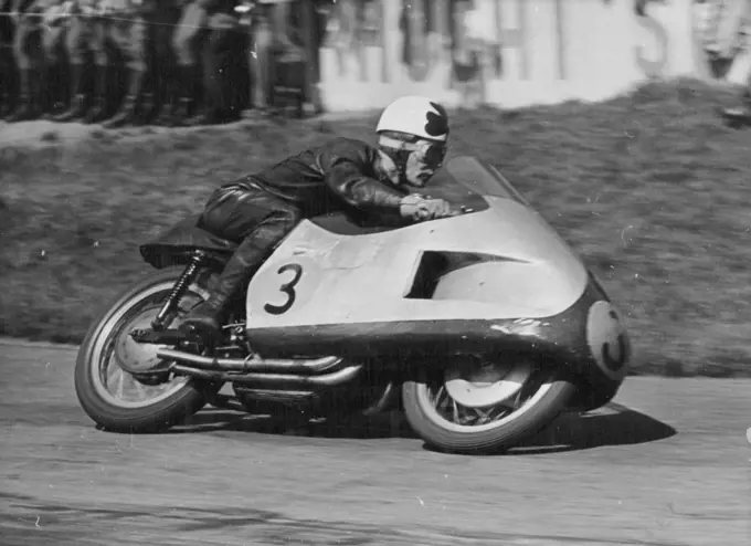 Duke Does it Again - Reg Armstrong of Australia piloted his Gilera to third place in the 500 C.C. Race at Hockenheim, behind Geoff Duke and Ken Kavanagh.Geoff Duke, Britain's World 500 CC Motorcycle Champion Robe his 500 CC Gilera to victory in the Rhine cup races at Hockenheim, Germany on Sunday.More than 120,000 fans saw him set up a lap record of 123.83 miles an hour. He covered the 20 laps in 47 minutes 12.5 seconds.Ken Kavanagh of Australia was second in this event and also won the 350 CC Race on his Moto-Gizzi at 111.84 miles an hour. May 10, 1955. (Photo by Paul Popper).