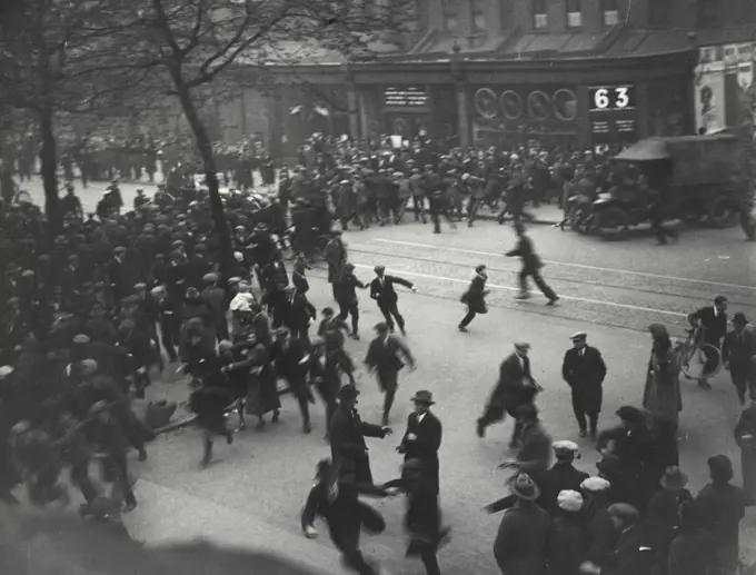 The General Strikes -- The crowd running as a police car arrives. Police are seen with drawn batons. A snap in New Kent Road on Thursday night.January 26, 1936. (Photo by London News And Agency Photos Ltd.).