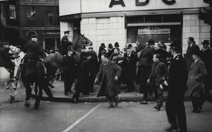 Dockers Trail At The Old Bailey -- Mounted and foot police clearing demonstrators during the disturbances, outside the court.Disturbances Outside Court. Disturbances took place outside the Old Bailey in London, during the closing stages of the trial of the seven clock-workers accused of illegal conspiracy to incitement men to take part in illegal strikes. April 17, 1951. (Photo by Sport & General Press Agency, Limited).