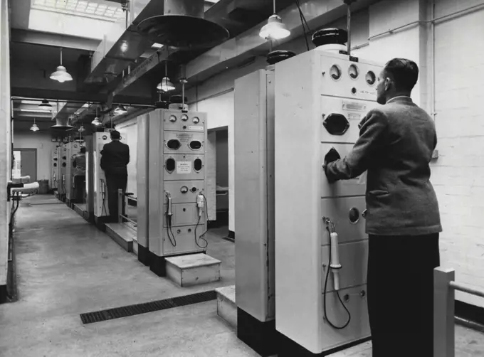 Britain's Atomic Factories - First Picture Of Production -- "Hand and Foot" radiation monitors are used daily by the men who work in the Windscale factory. These ensure that workers do not carry away radio-active material on their hands or clothes. The health physics and safety department are responsible for ensuring that maximum permissible levels of activity are not exceeded anywhere in the plant or the surrounding country. June 1, 1954. (Photo by British Official Photograph).