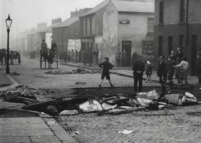 The Riots in Belfast -- ***** street, Falls Road, one of the many thoroughfares in this ***** where the roads were torn up to obstruct the armoured *****. November 21, 1932. (Photo by Central News).