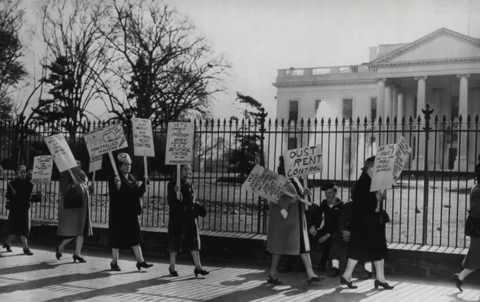 Detroit Landladies Picket White House -- Seven landladies from Detroit carry placards along Pennsylvania avenue in front of the White House today, in their right against rent controls. Some of their signs read: "Oust rent control" and "Veterans want housing, not dictatorial rent control. " November 19, 1946. (Photo by AP Wirephoto).