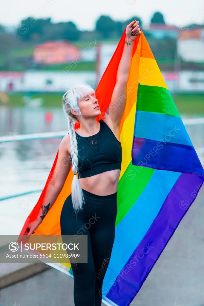 Lesbian girl holding LGBT flag