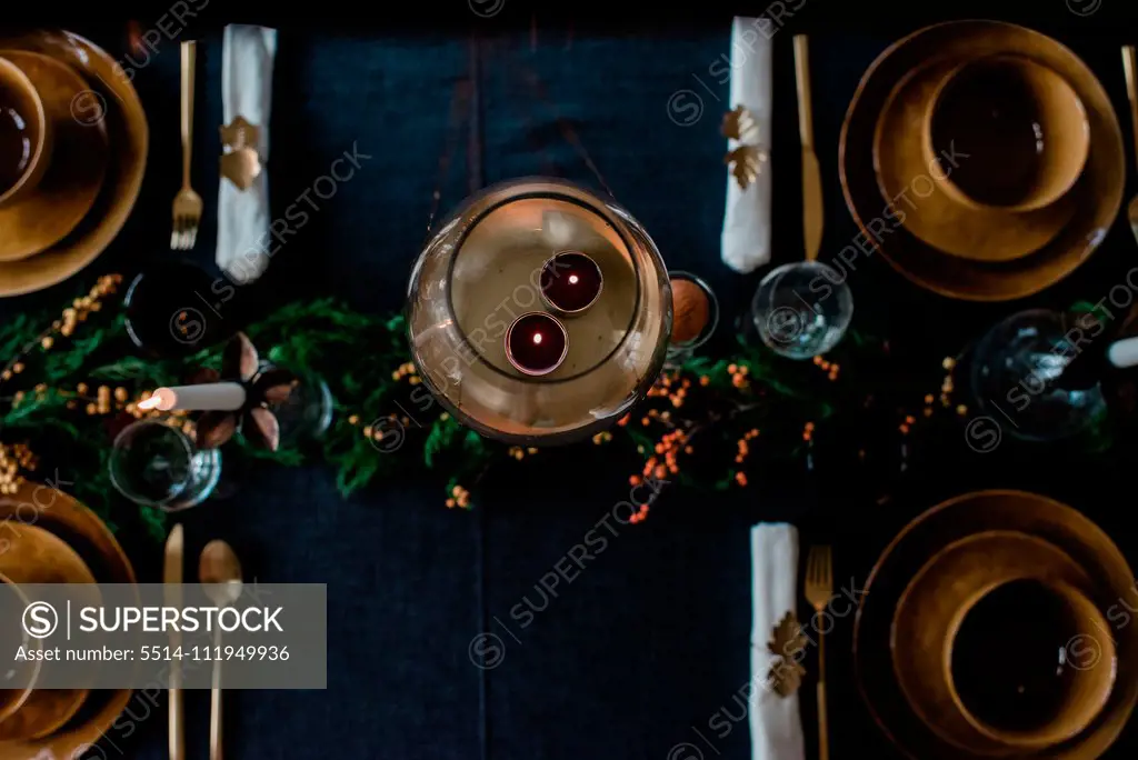 tea light candles in a candle holder on a decorated dinner table