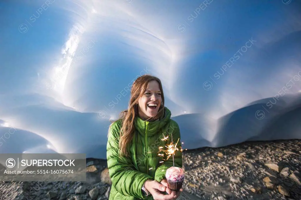 Adventurous woman celebrates her birthday in an ice cave.