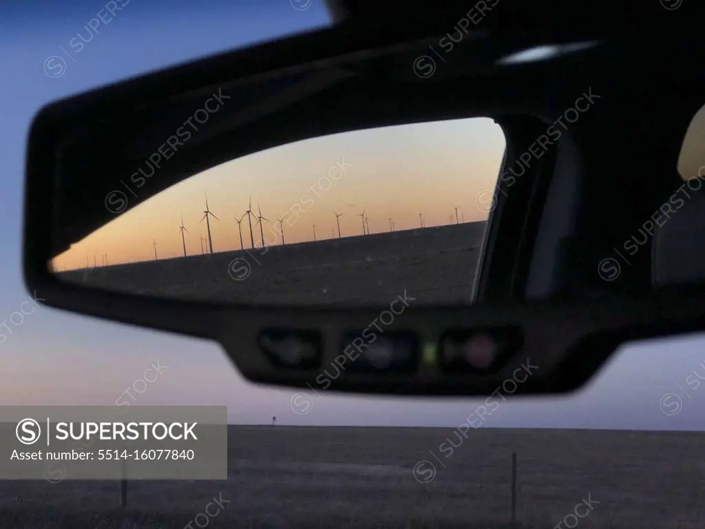 Looking in rearview mirror of wind turbines