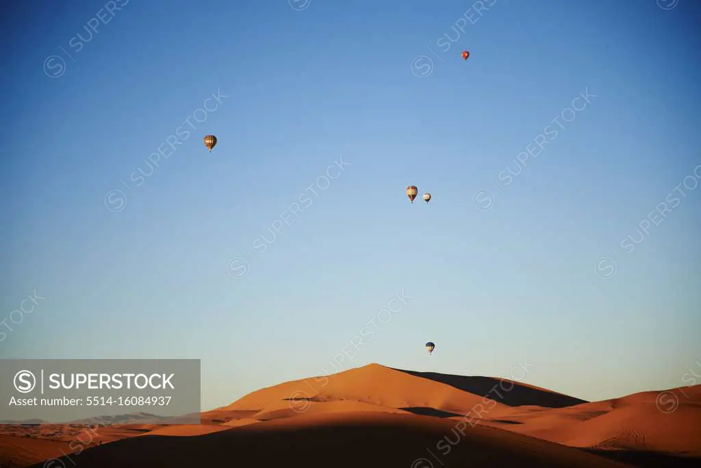 Hot air balloons over the dunes of the merzouga desert