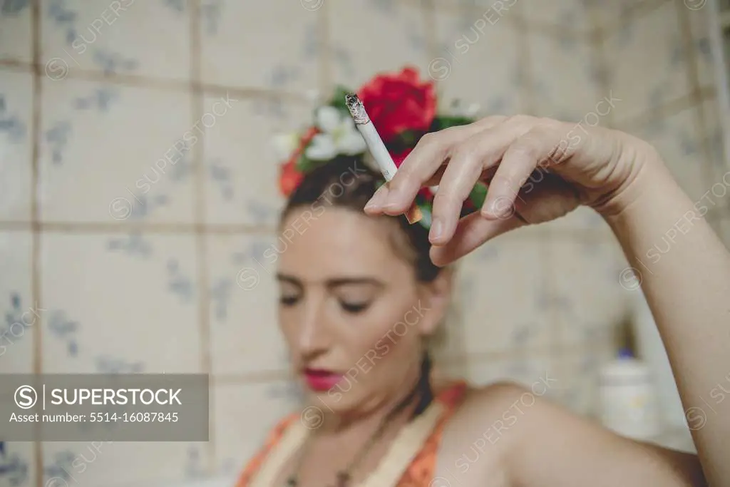 Frida Khalo smoking in the bathroom