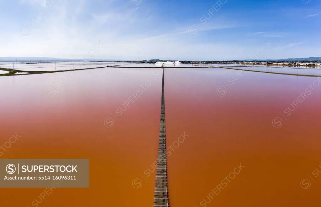 Aerial of Vivid Pink Salt Evaporation Ponds in SF Bay Marshland