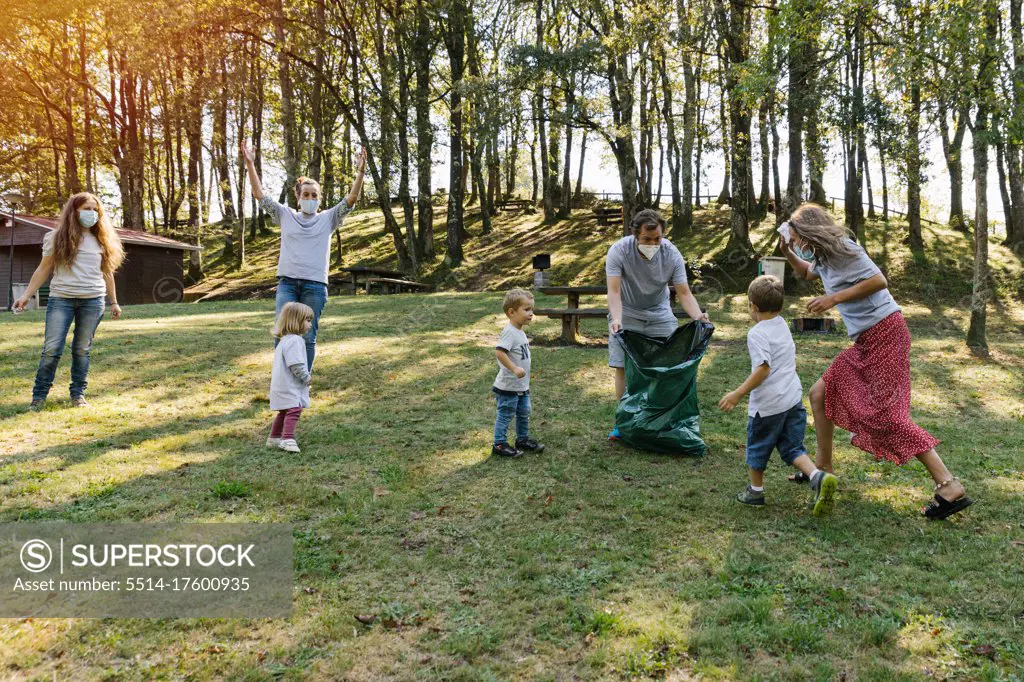 Group of volunteer families a forest. Environmental protection concept