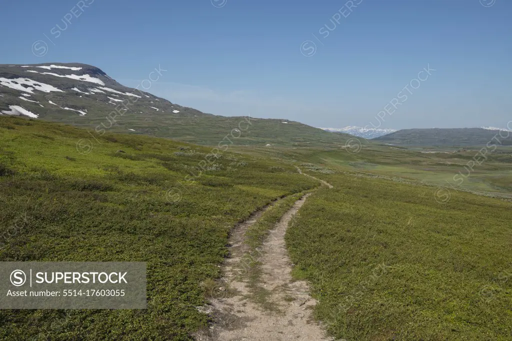 Single track trail of Padjelantaleden Trail though high mountain terrain north of Duottar in Padjelanta national park, Lapland, Sweden