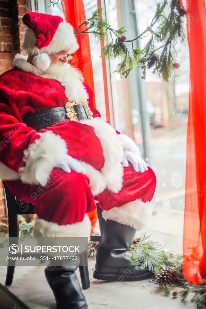 Santa Claus Asleep in Window