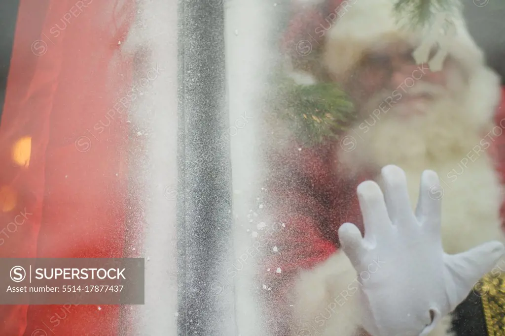 Santa reaches out to connect through window
