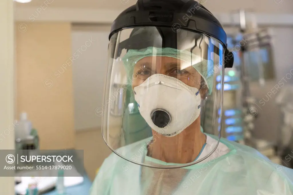 a nurse is in protective gear against covid-19