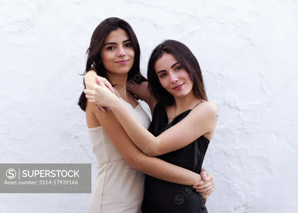 Two Spanish Teen Sisters Hug Each Other Funny