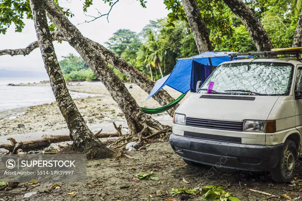 Campers living in van on parked on beach, Costa Rica