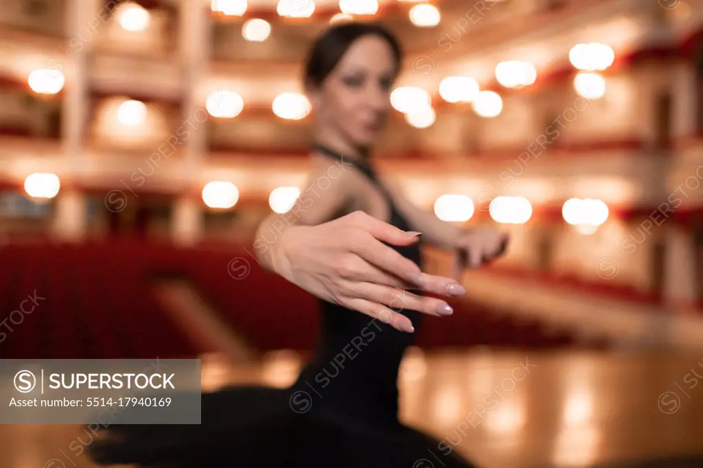 Ballerina during performance in empty theater
