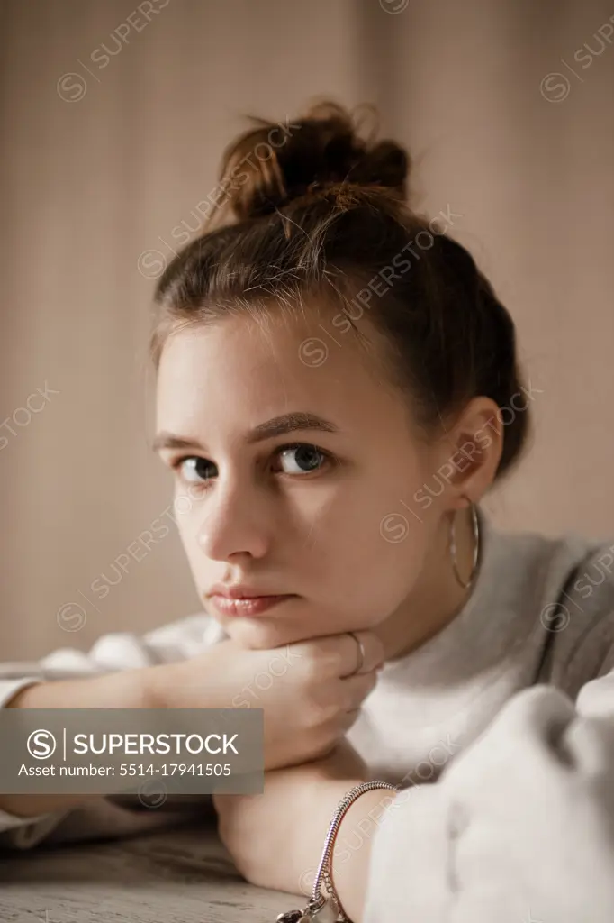 Portrait of girl against brown background