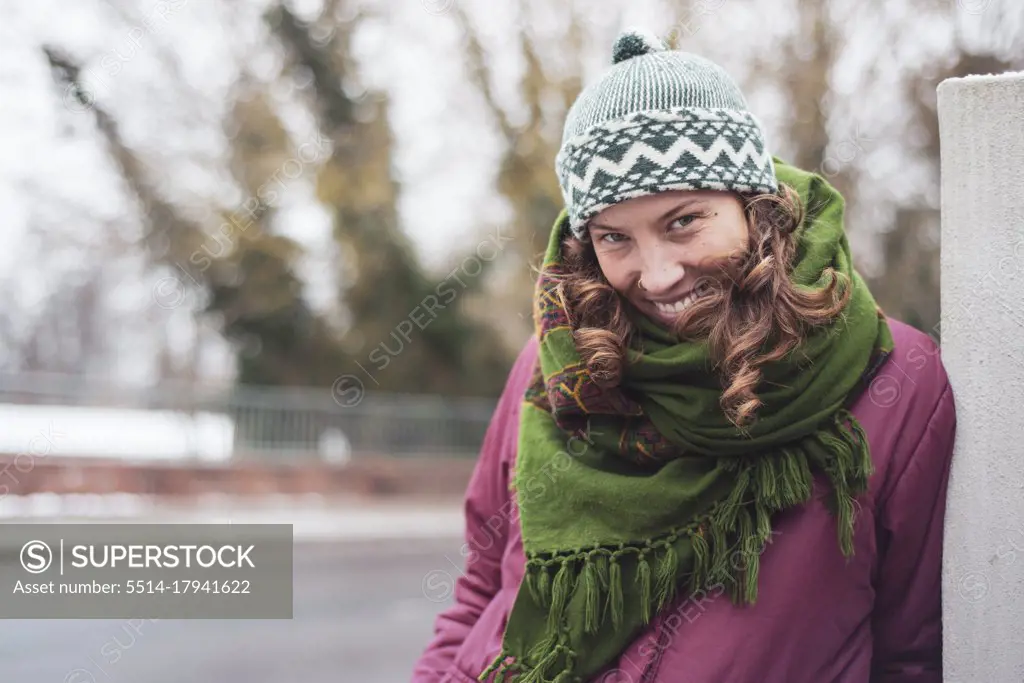 portrait of smiling happy pretty european woman in winter clothes