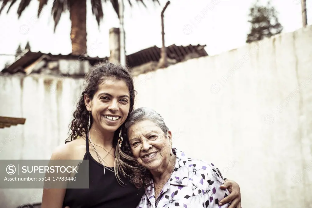 Smiling family portrait of Mexican female generations