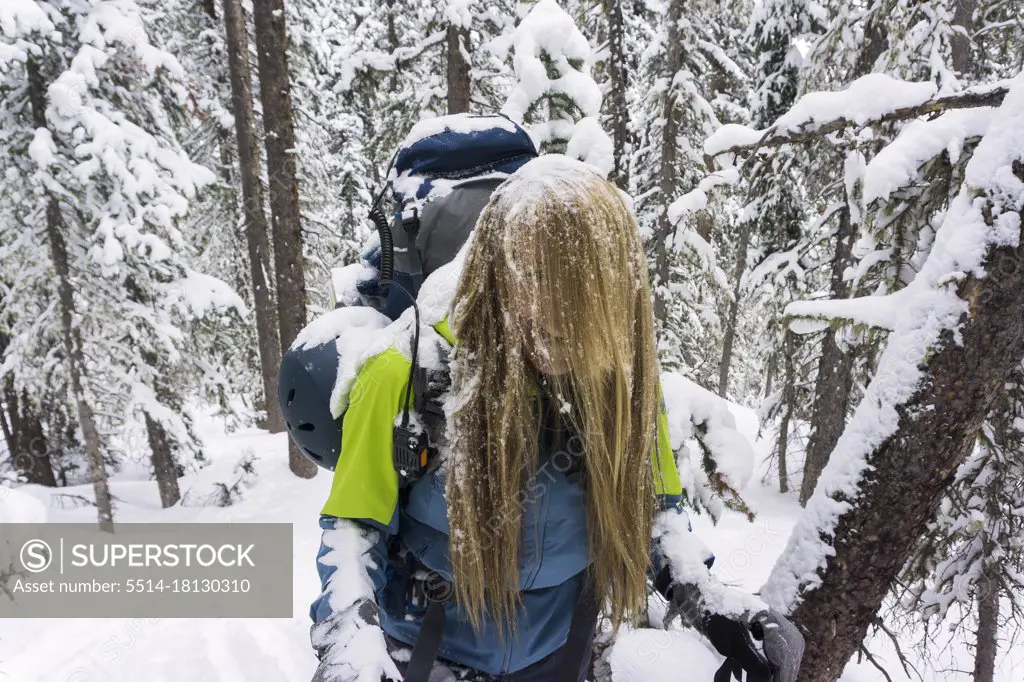Young female ski touring in high mountains of Colorado
