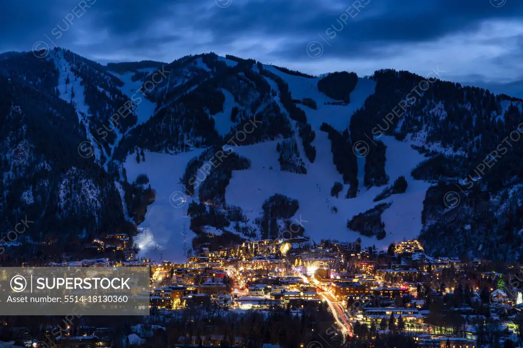 Illuminated buildings at Aspen Mountain in winter at night