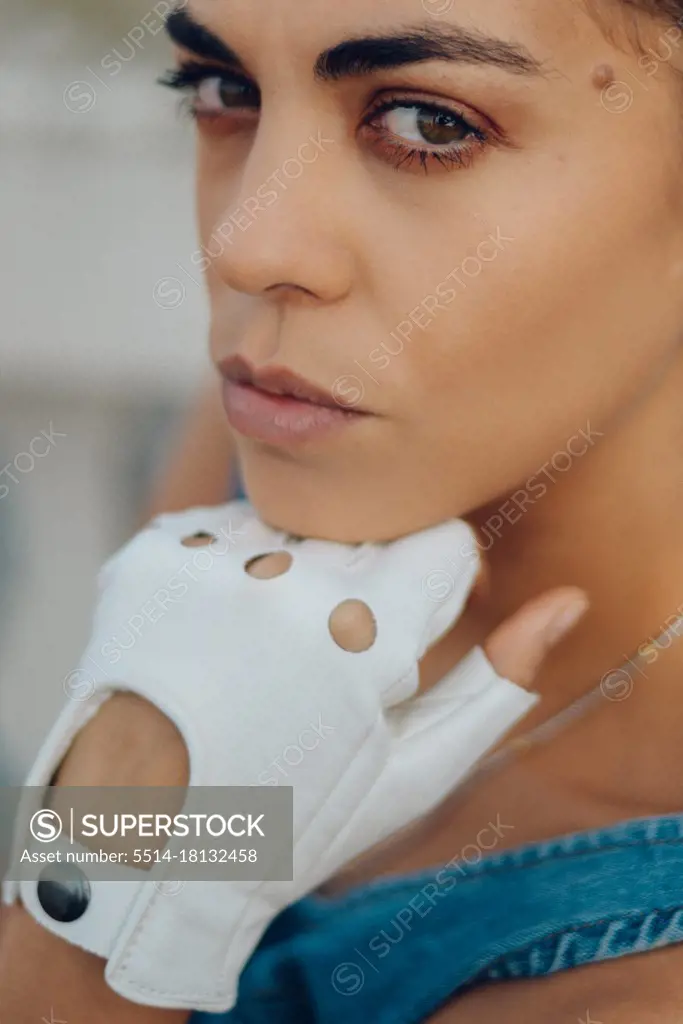 color portrait of a beauty woman wearing withe leather gloves