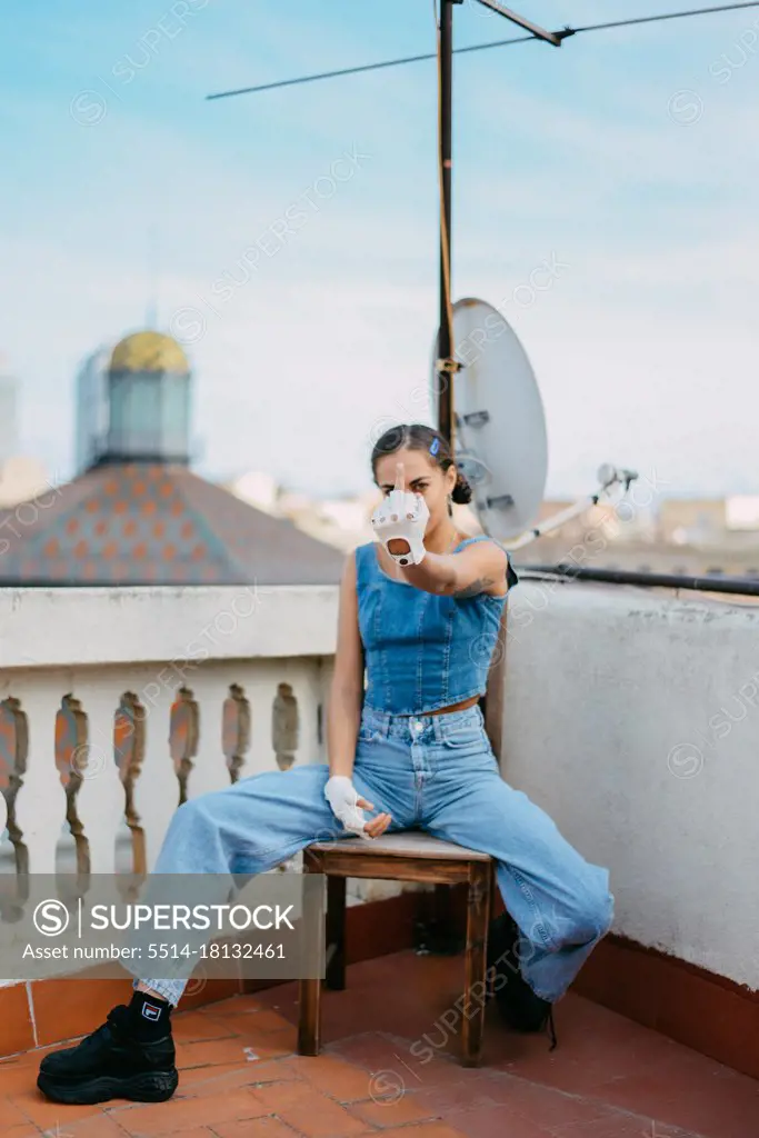 woman dressed all in jean on a terrace in barcelona