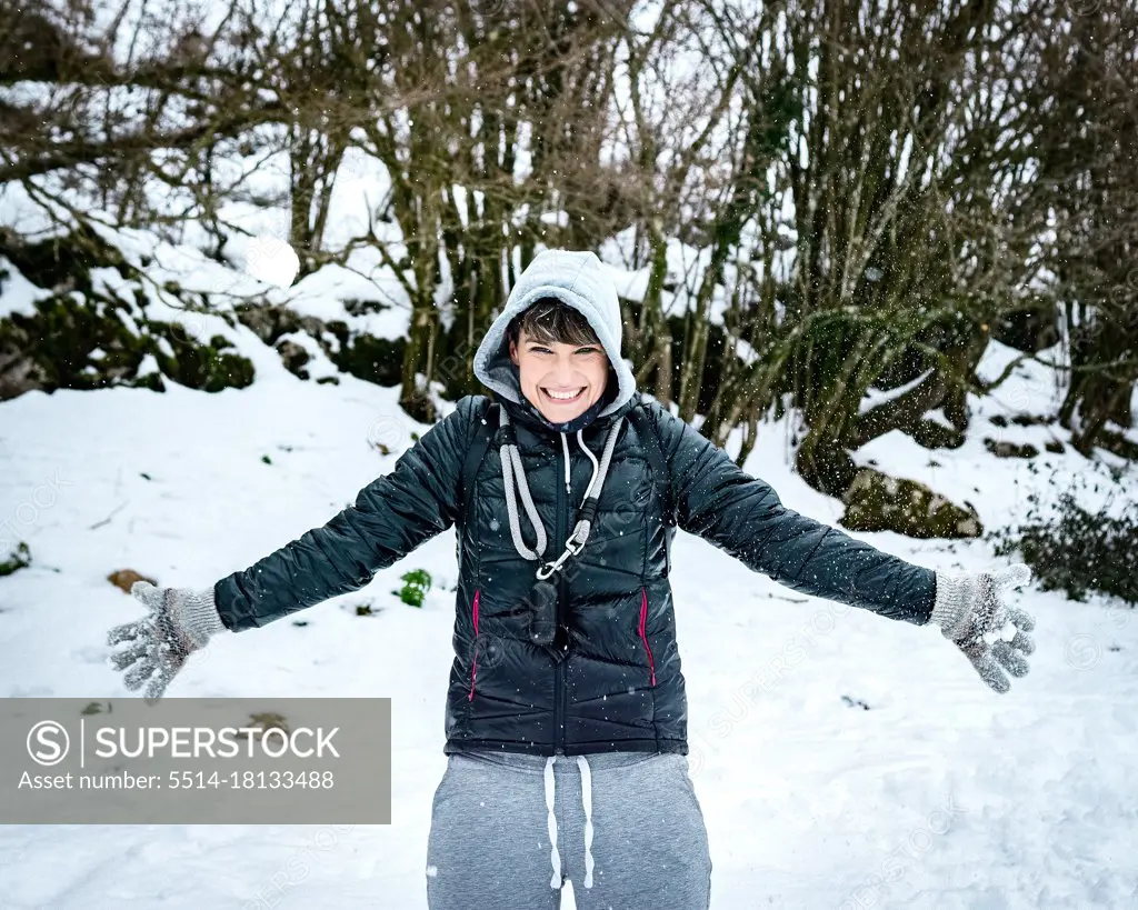 Young woman in snow happy fun