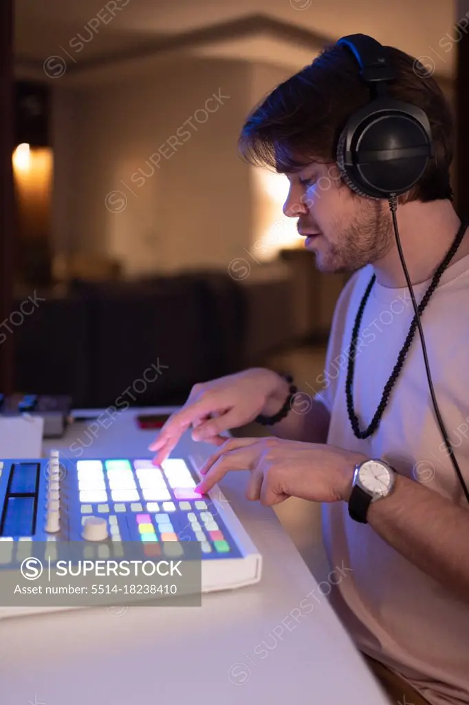 Man recording music on soundboard