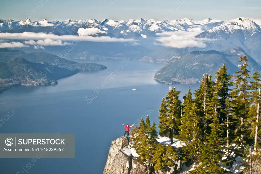 Man standing on cliff at Saint Marks Summit, Vancouver, B.C.