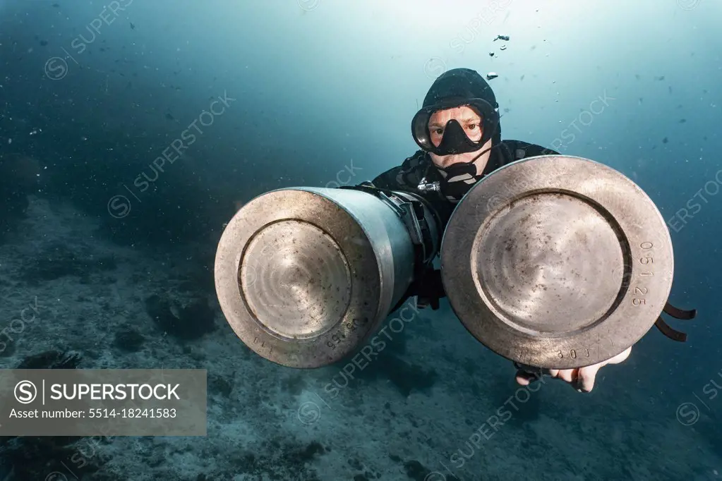 tech diver with side mounted air tanks in Raja Ampat / Indonesia