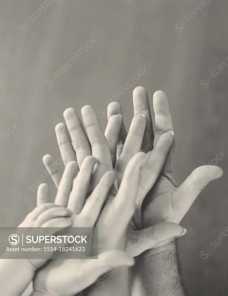 black and white hands with child