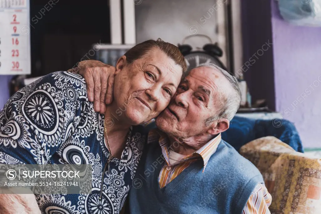 Portrait of an elderly couple embracing each other