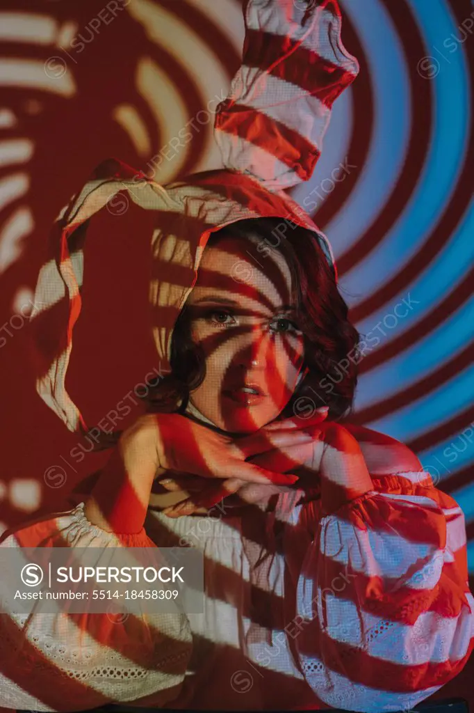 young woman in bonnet in projection light