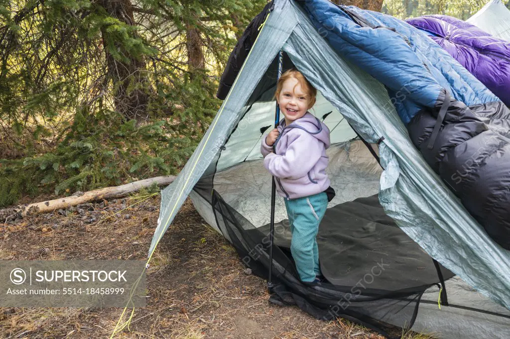 Happy girl on a camping trip in the Eagles Nest Wilderness, Colorado