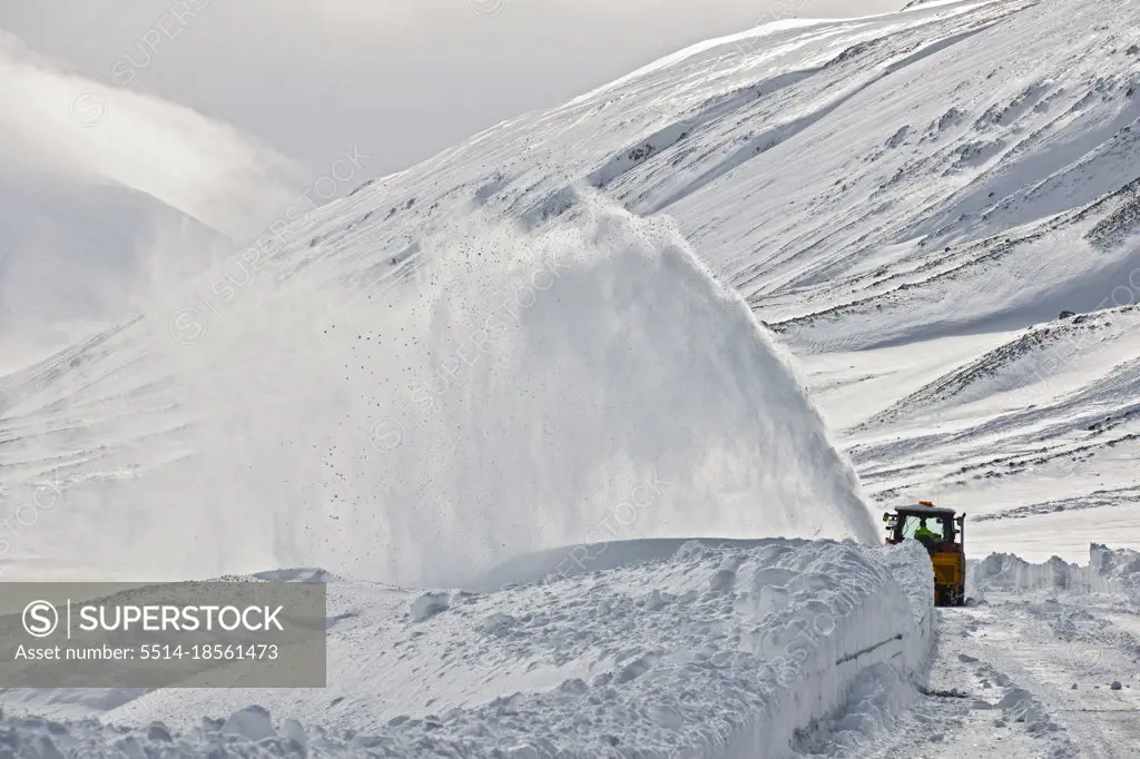 Snow plough clearing a mountain pass in north Iceland