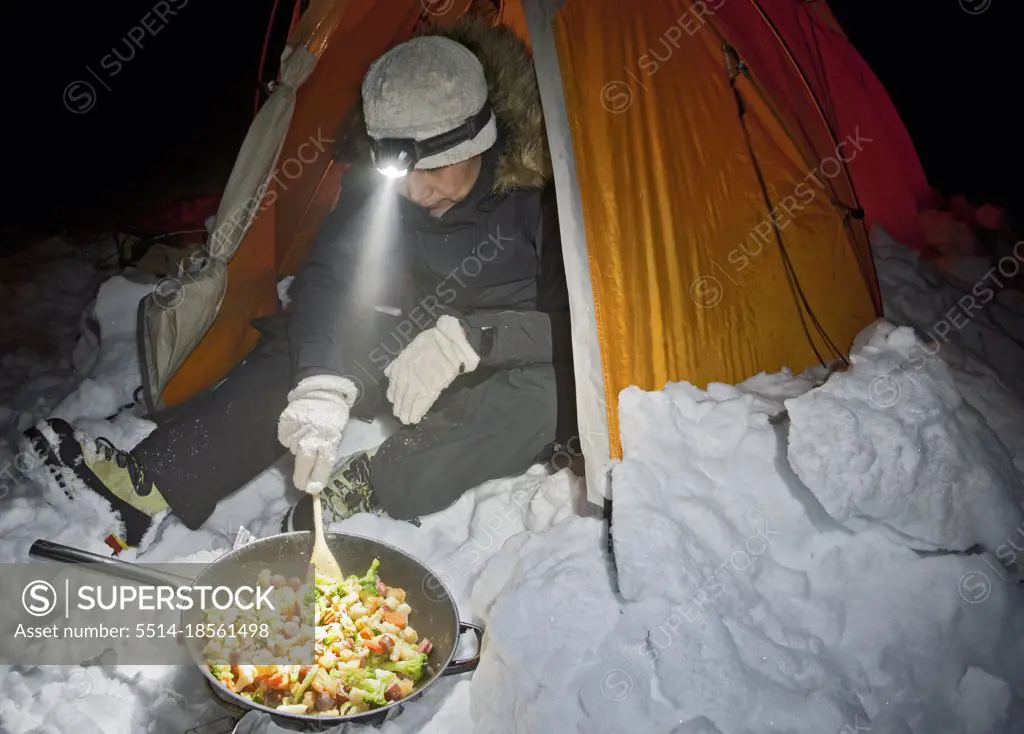 preparing dinner at a wintercamp on the Langjokull glacier in Iceland