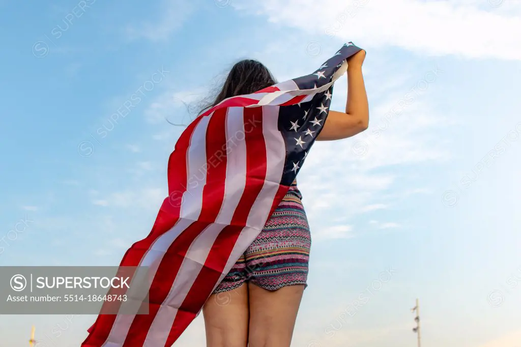 Rear view of woman with american flag