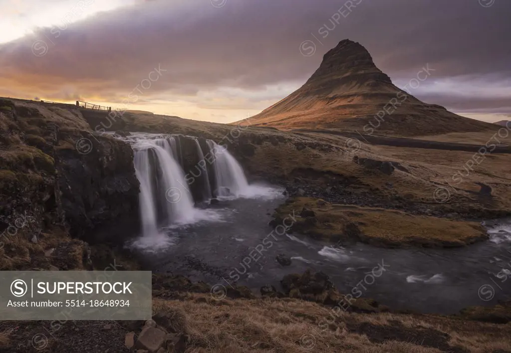 Kirkjufel volcanic mountain and waterfall at sunset