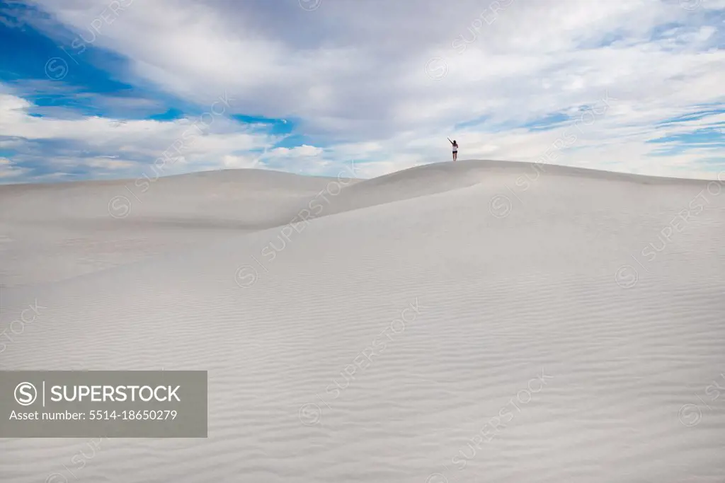 Girl On Top Of Pristine Sand Dune In White Sands New Mexico