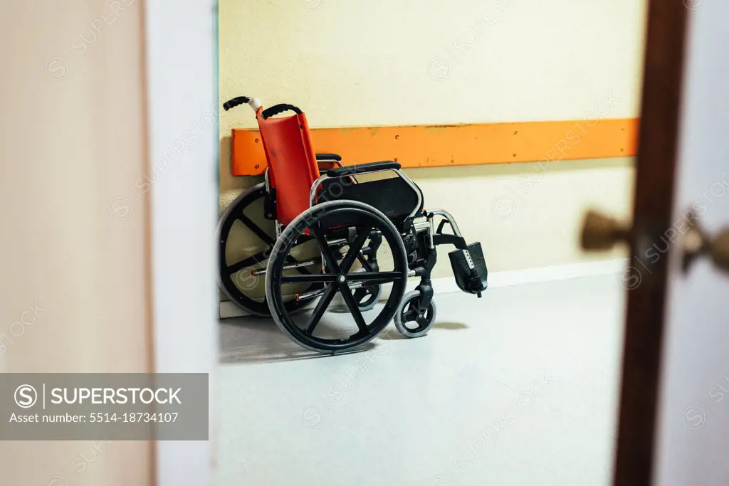 Wheelchair in a hospital corridor.