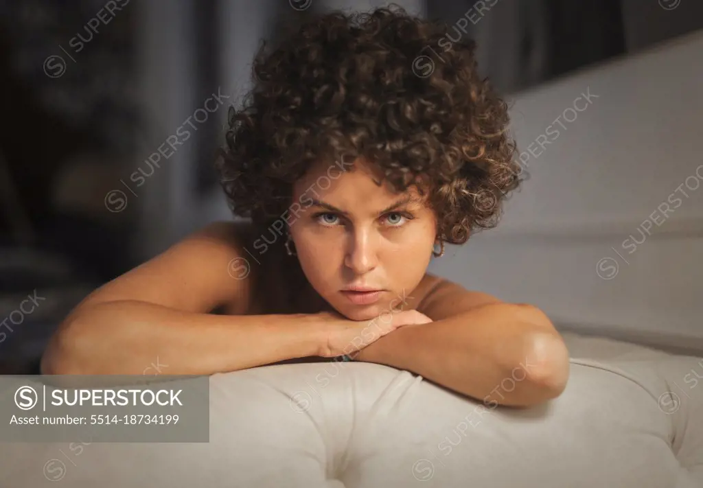 portrait of young woman on sofa