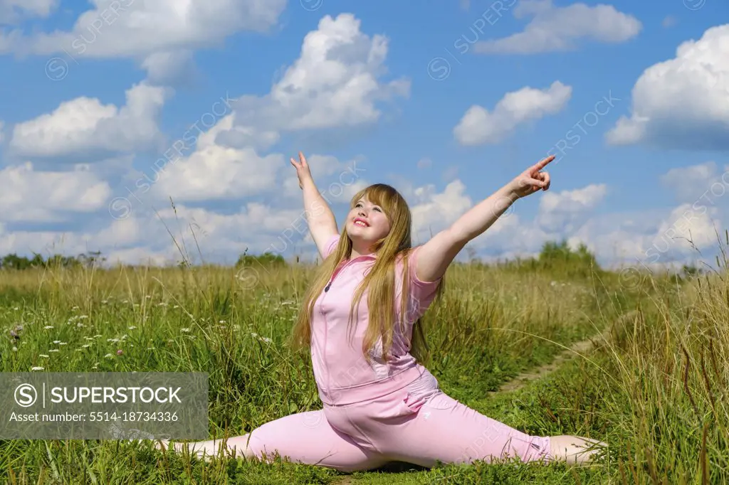 cheerful woman with down syndrome sitting on a twine