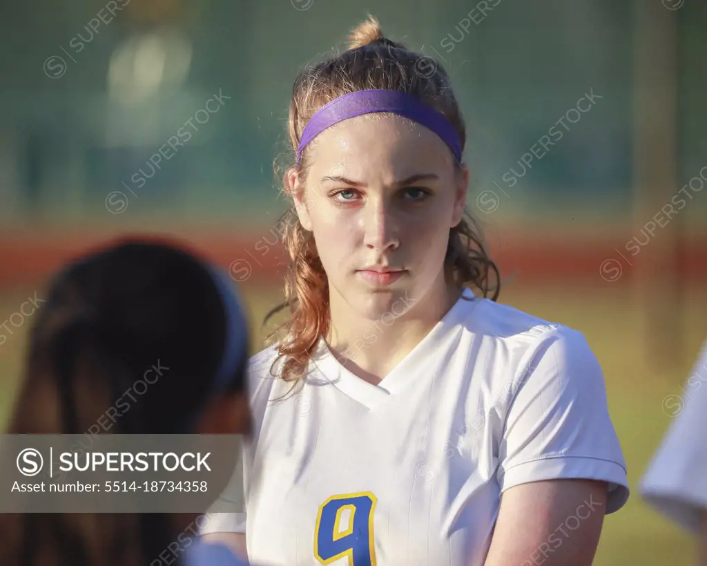 High school girl soccer player with serious game face expression