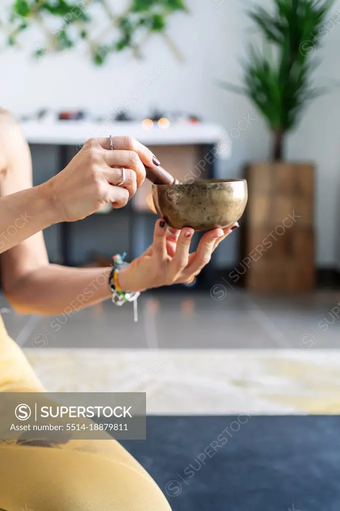 sporty woman touching her yoga vase