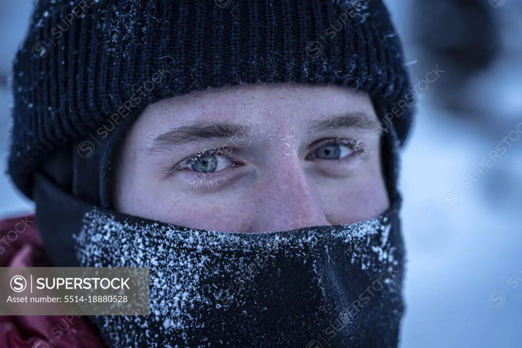 Close-up portrait of man in hat during winter